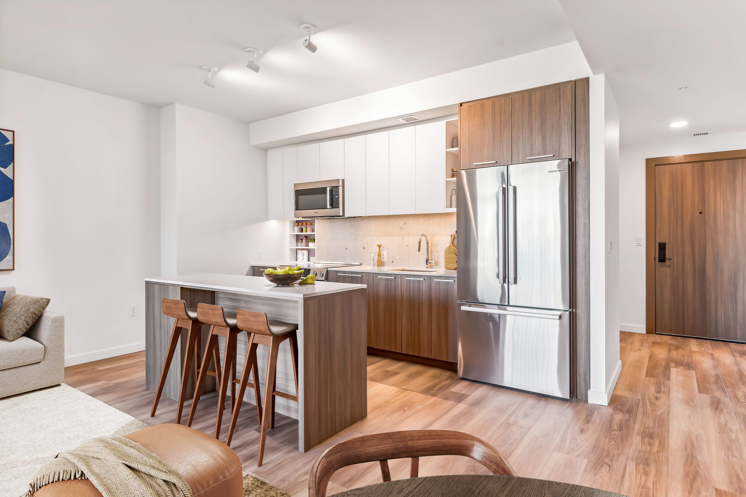 Kitchen & dining room in one of Stratos' luxury apartments in Bridge District in DC